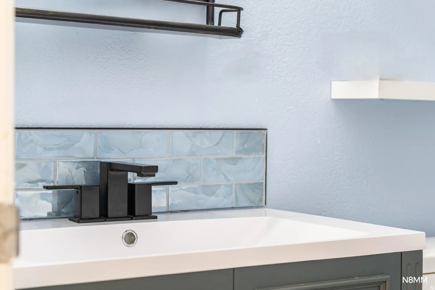 Bathroom detail featuring custom tile work