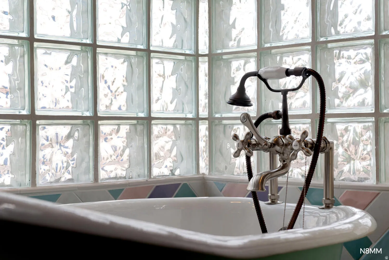 Bathroom view of a sink and a freestanding tub