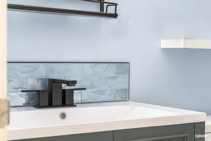 Bathroom detail featuring custom tile work