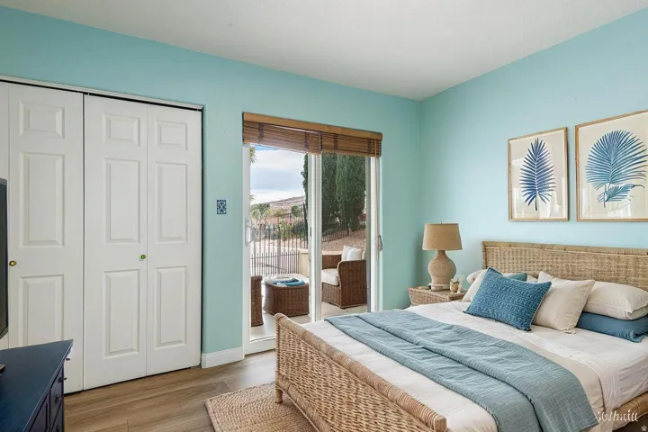 Bedroom featuring access to outside, a closet, and light wood-type flooring