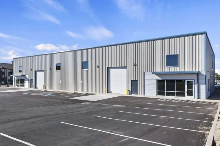 View of commercial location featuring uncovered parking