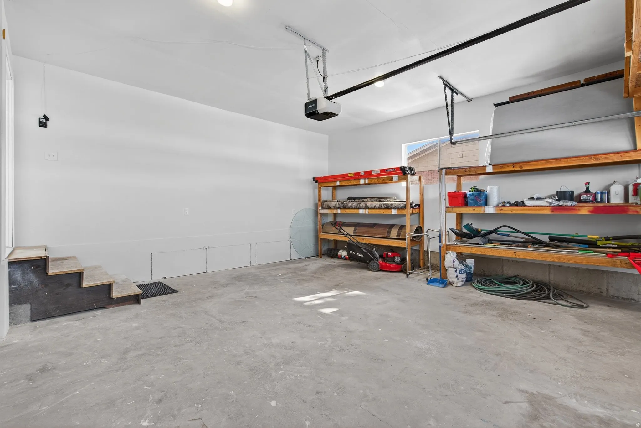 Garage featuring a garage door opener