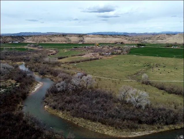 Overview of rural landscape featuring a water and mountain view