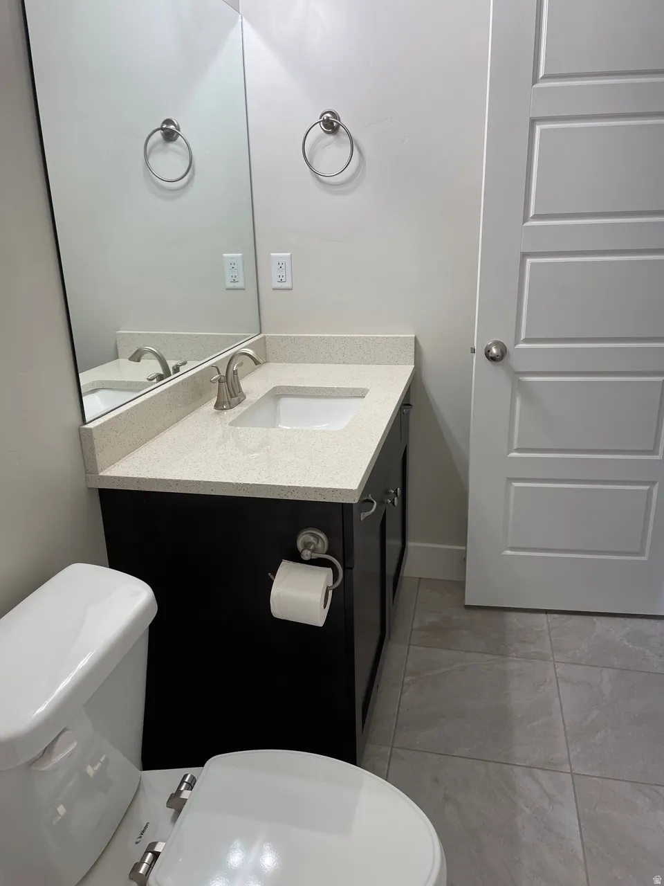 Bathroom with vanity and light tile patterned floors