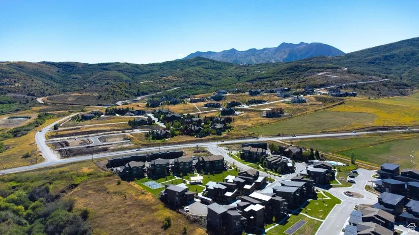 View of property location with a mountainous background and nearby suburban area