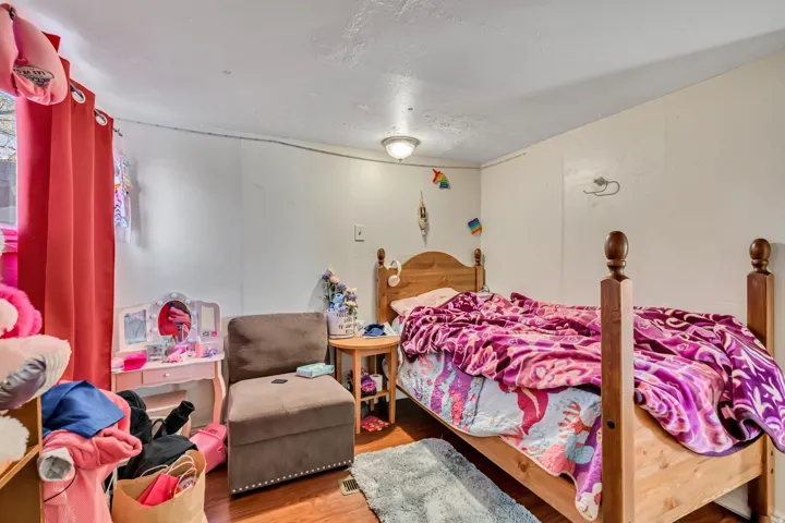 Bedroom with wood finished floors