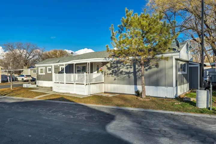 View of front of property featuring roof with shingles