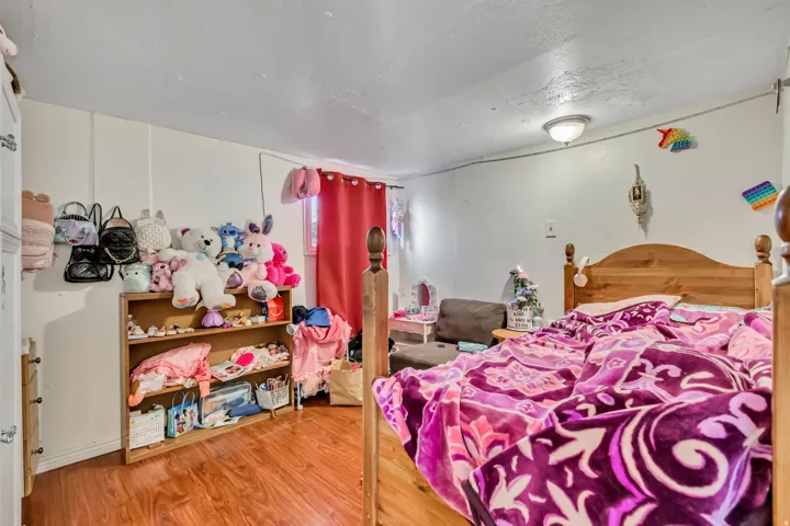 Bedroom with wood finished floors