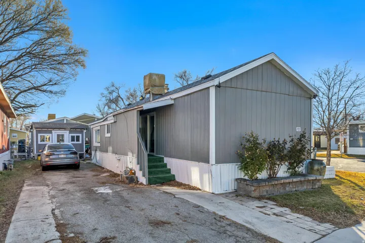 View of property exterior featuring driveway