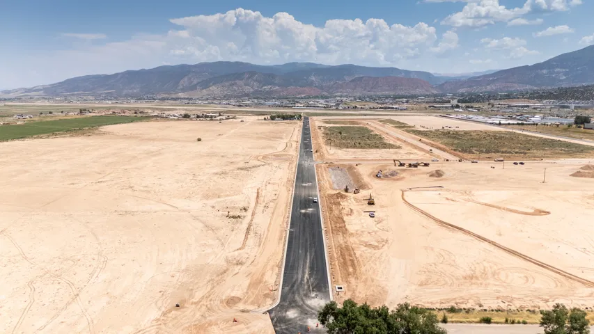 Aerial view of sparsely populated area featuring a mountain backdrop