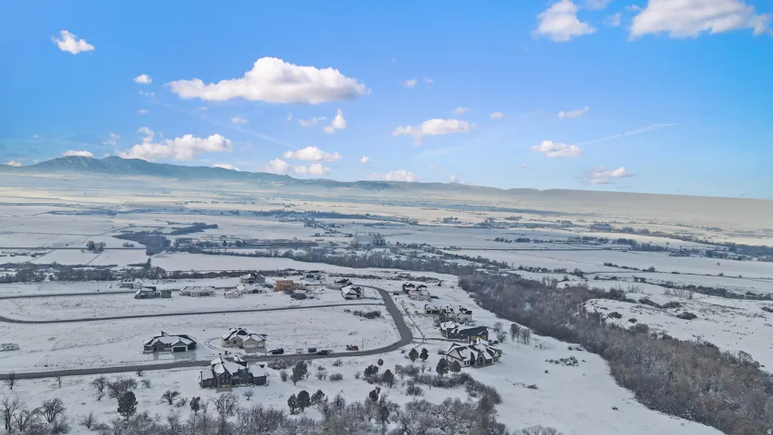 Snowy aerial view with a mountain view