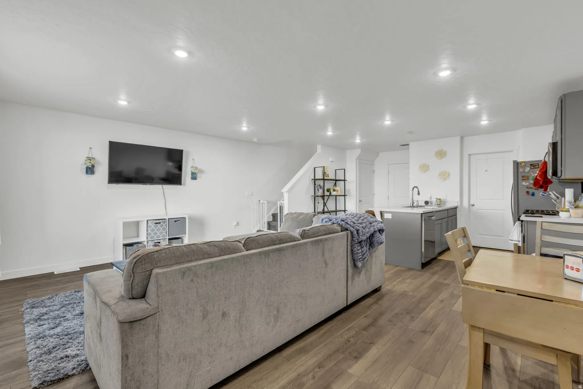 Living room featuring wood finished floors and recessed lighting
