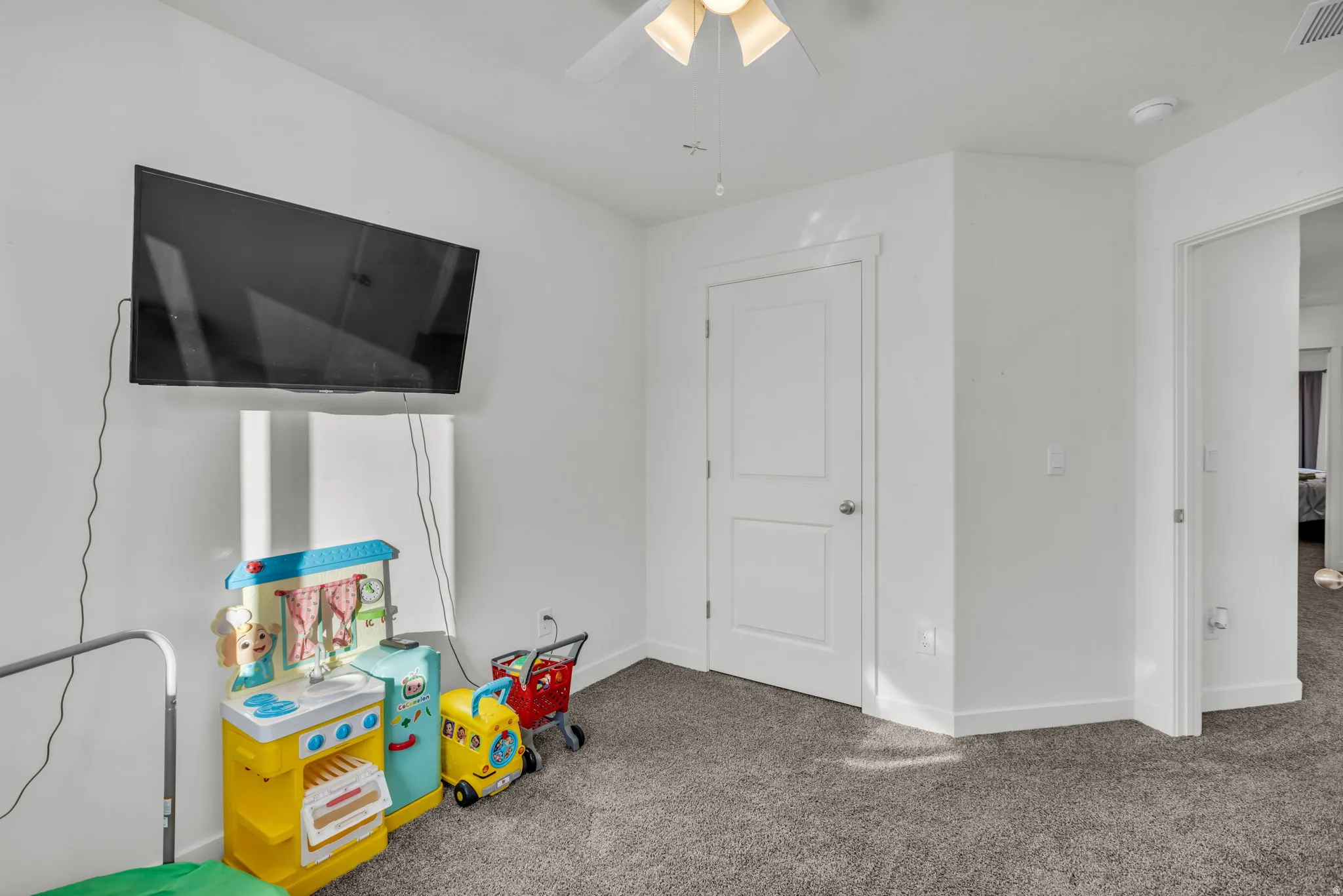 Game room featuring carpet flooring and a ceiling fan