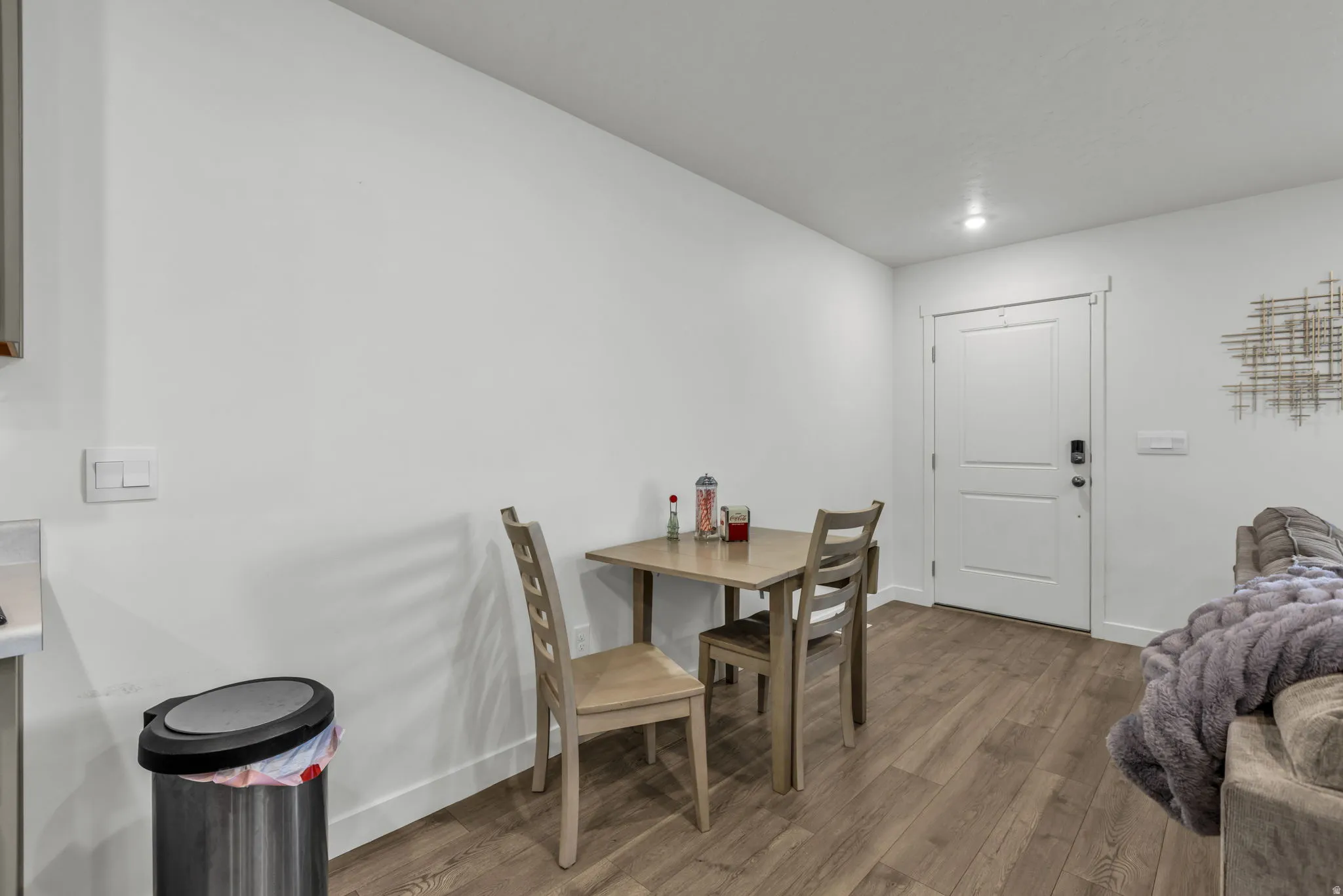 Dining room featuring wood finished floors and baseboards