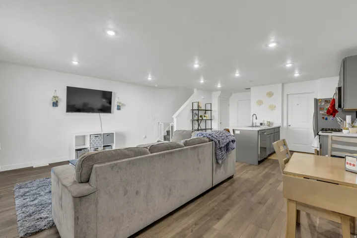 Living room featuring wood finished floors and recessed lighting