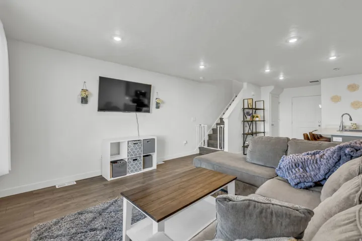 Living room featuring wood finished floors and recessed lighting