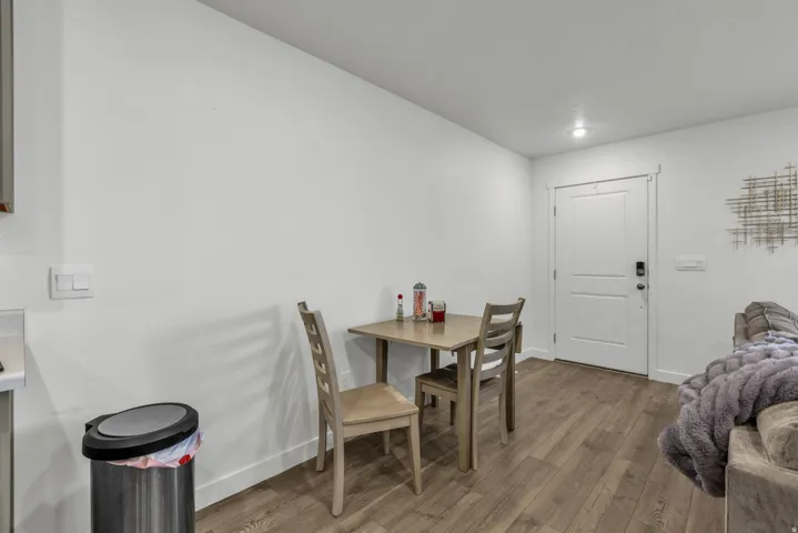 Dining room featuring wood finished floors and baseboards