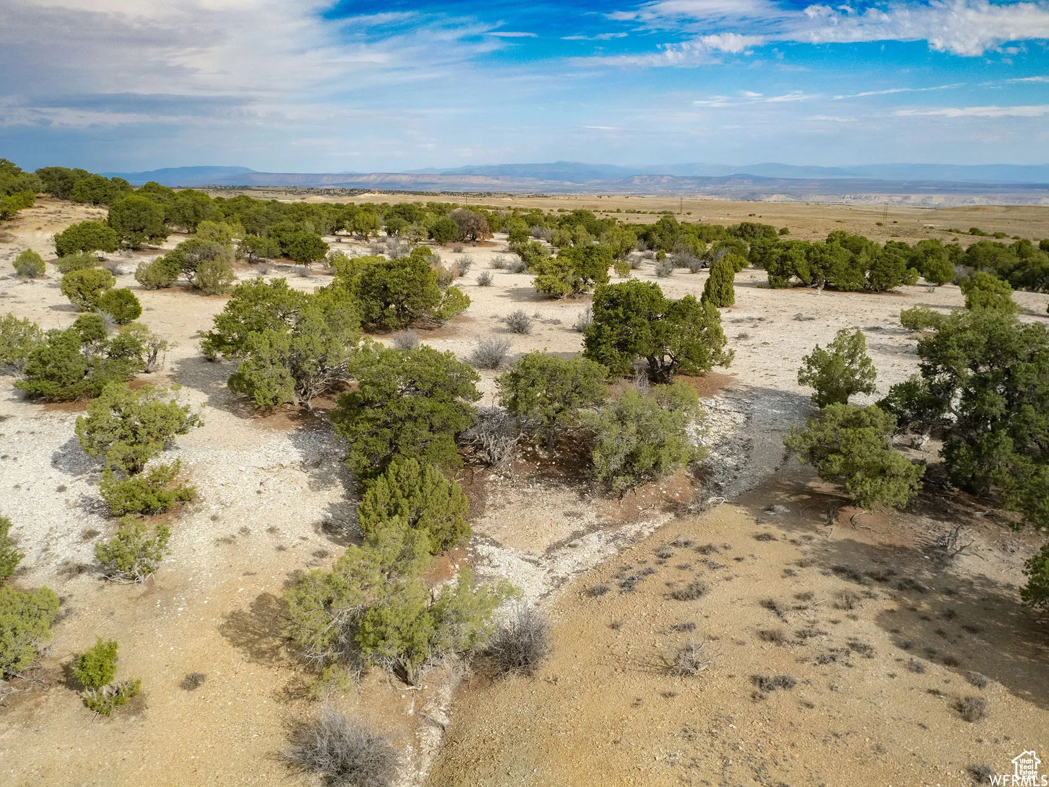 Aerial view of sparsely populated area with mountains