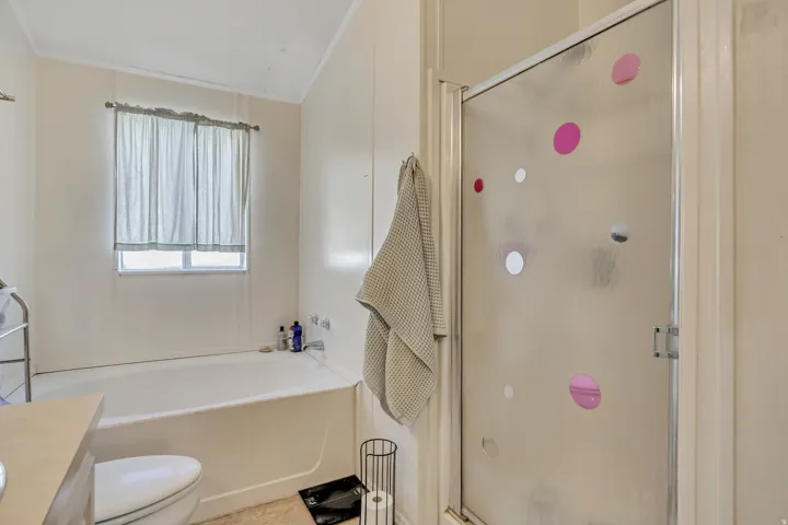 Full bath with vanity, a stall shower, and a garden tub