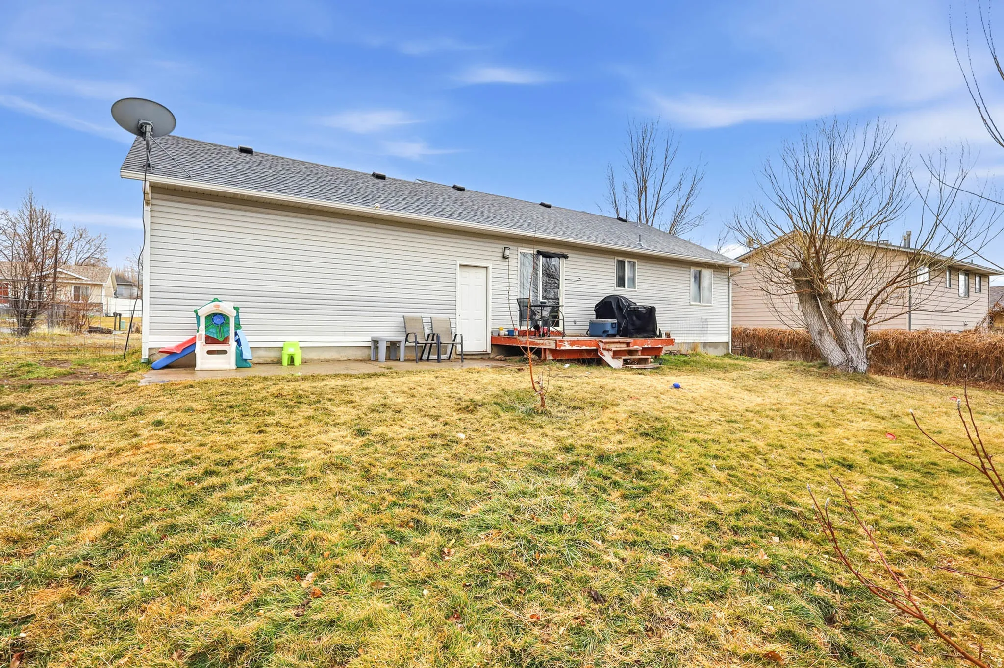 Back of property with a wooden deck