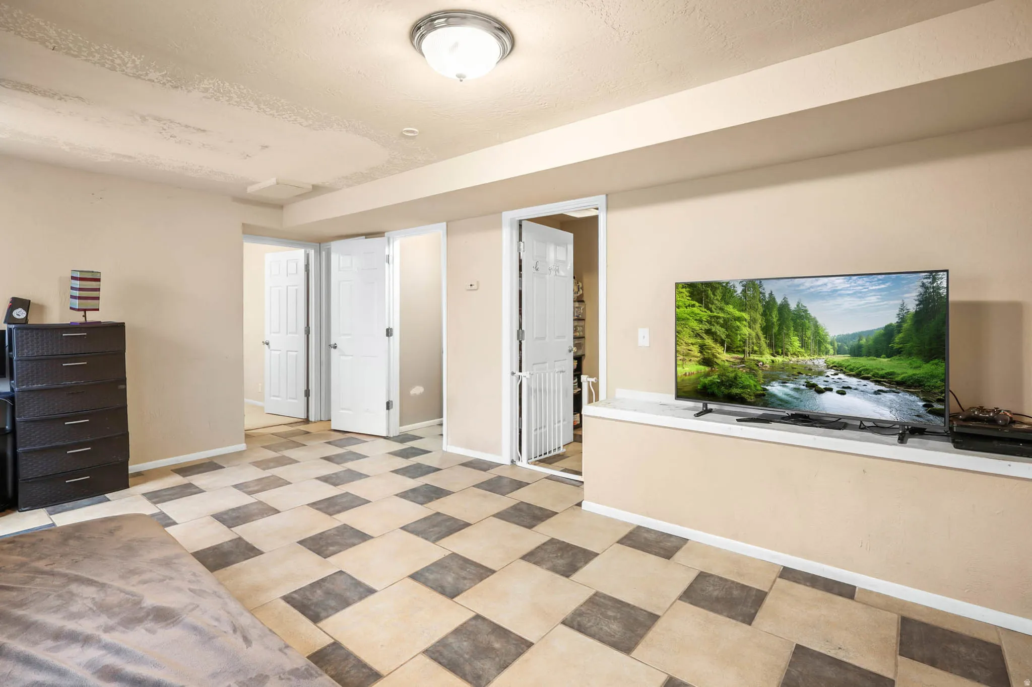 Interior space featuring baseboards and a textured ceiling