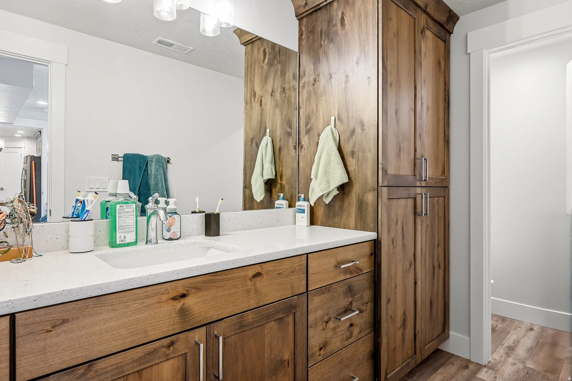 Bathroom with vanity and light wood-type flooring
