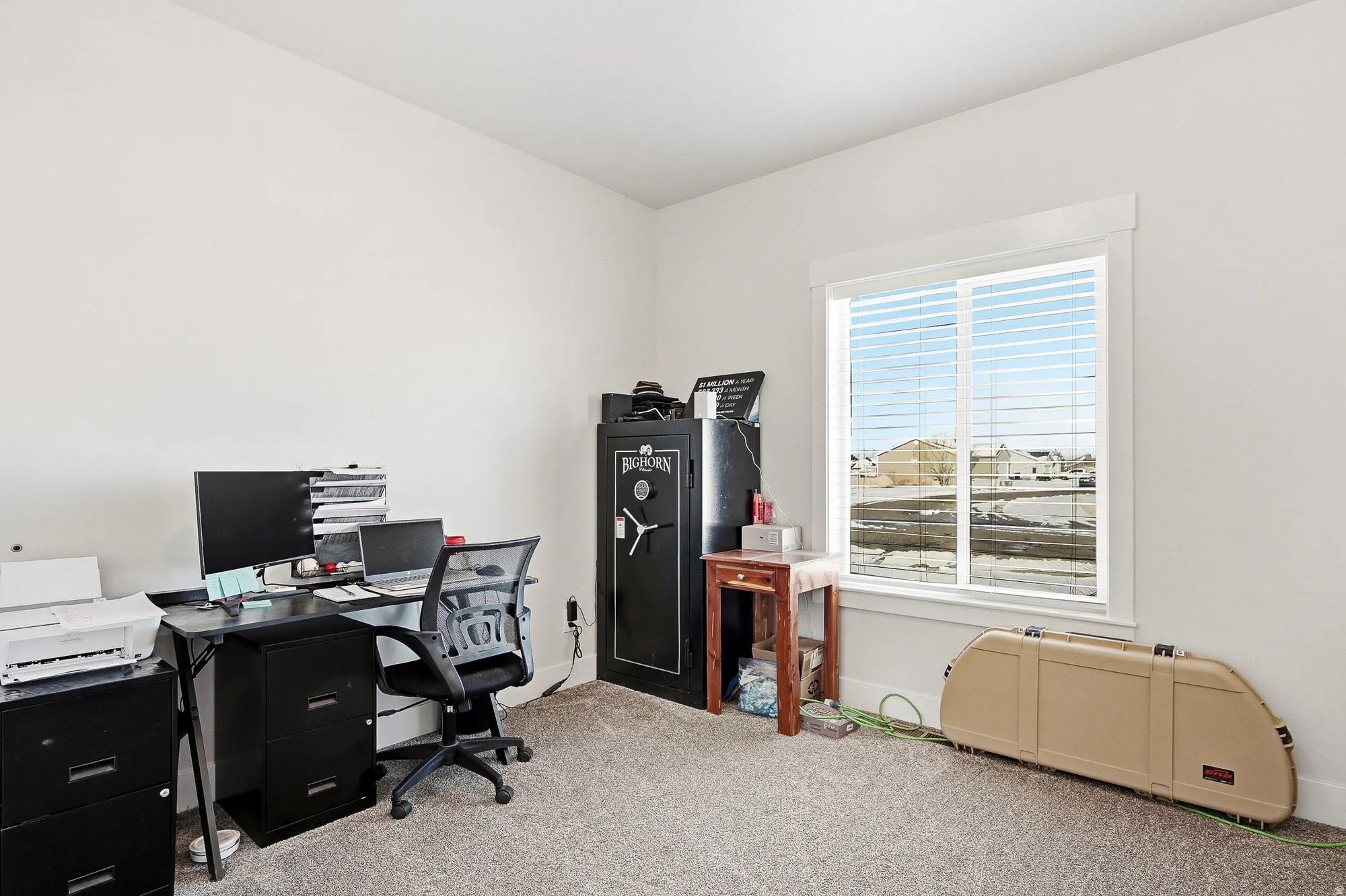 Carpeted office with baseboards