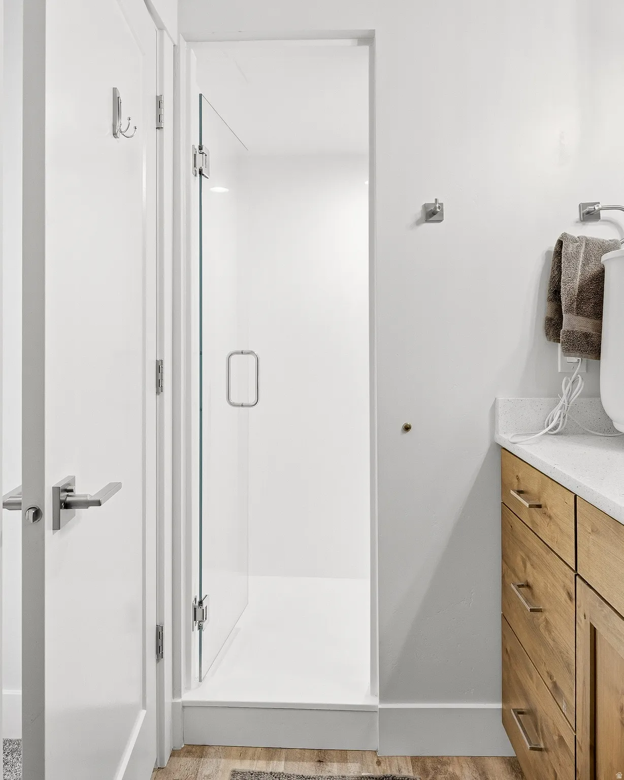 Full bath with a stall shower and vanity