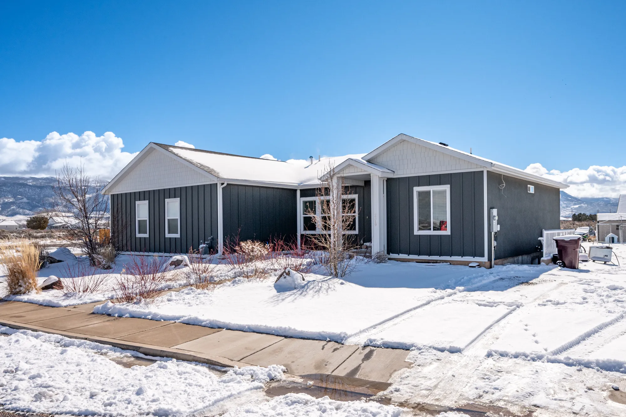 View of front facade with board and batten siding