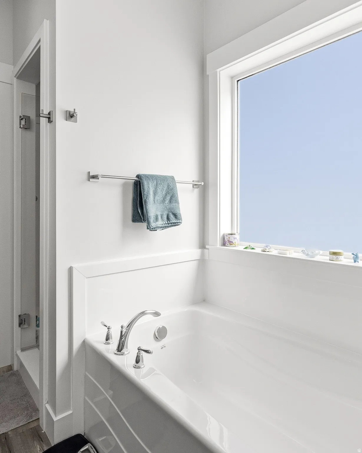 Bathroom with a stall shower and a garden tub