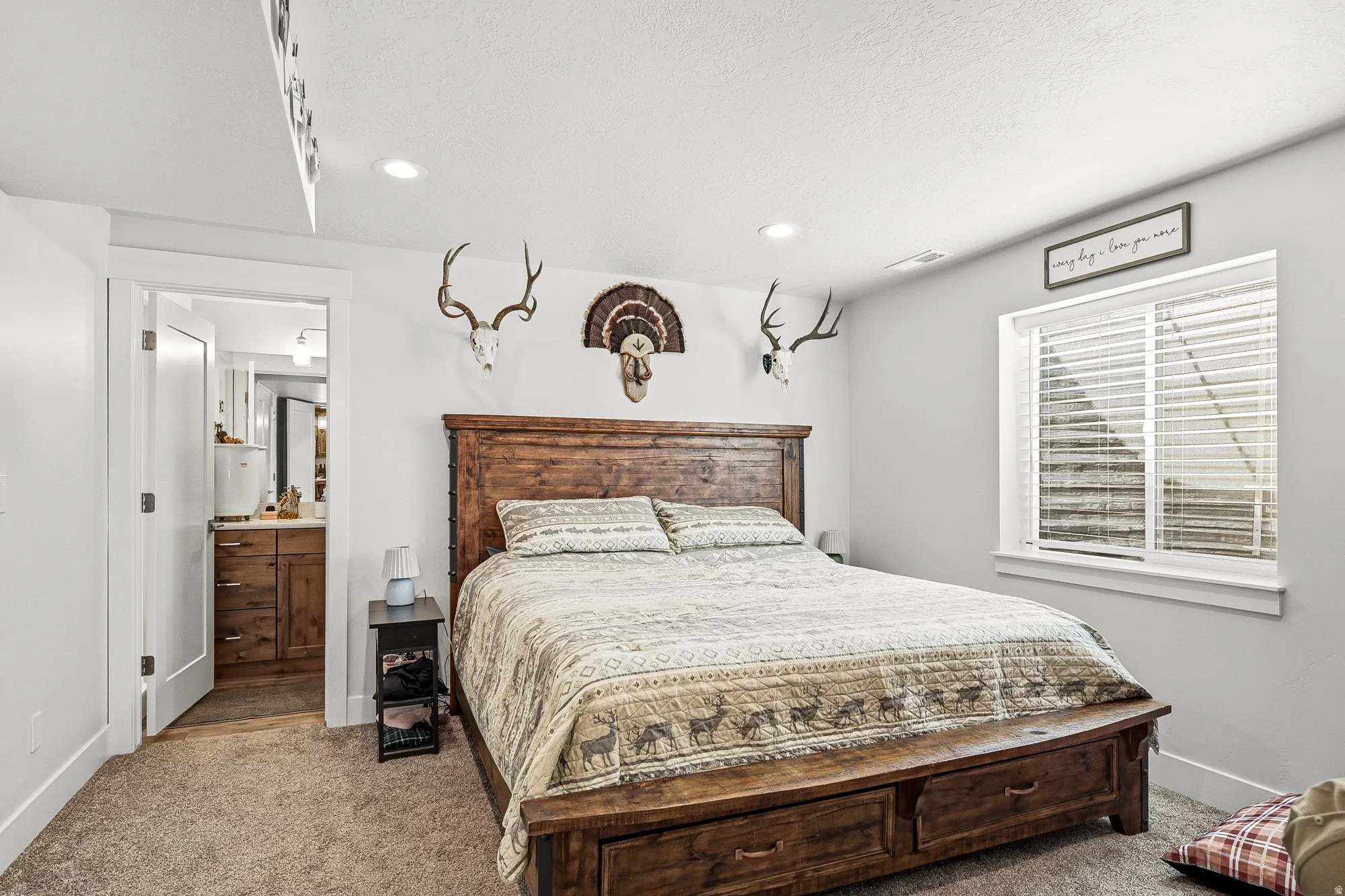Bedroom with carpet, recessed lighting, and ensuite bath