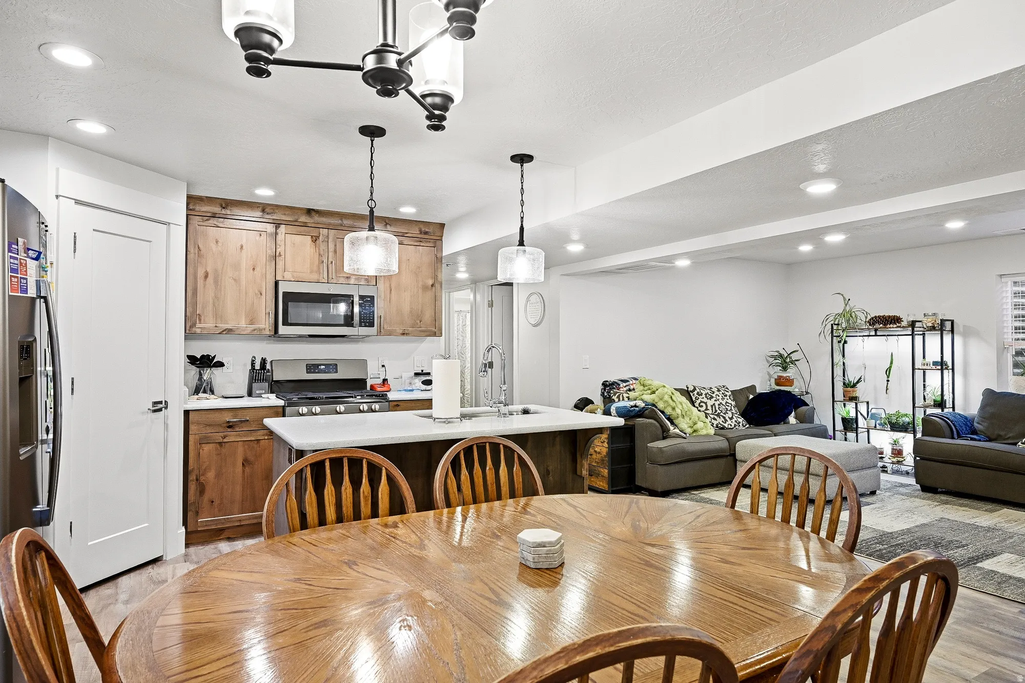 Dining space featuring recessed lighting and light wood-style flooring