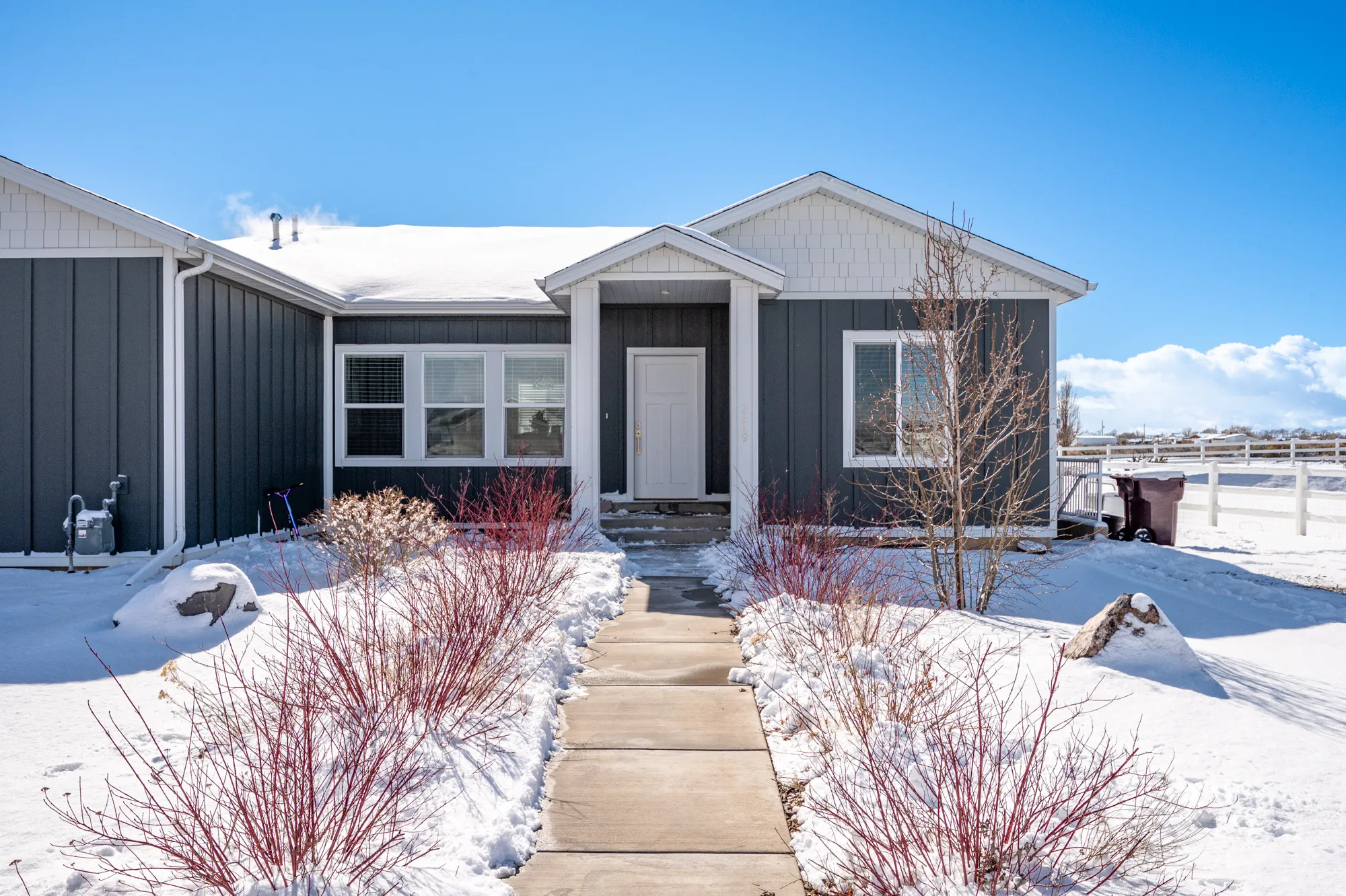 View of front facade with board and batten siding