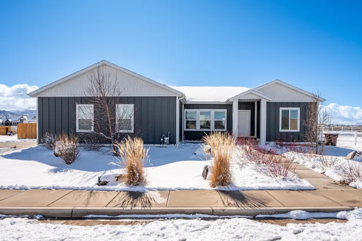 Ranch-style home with board and batten siding