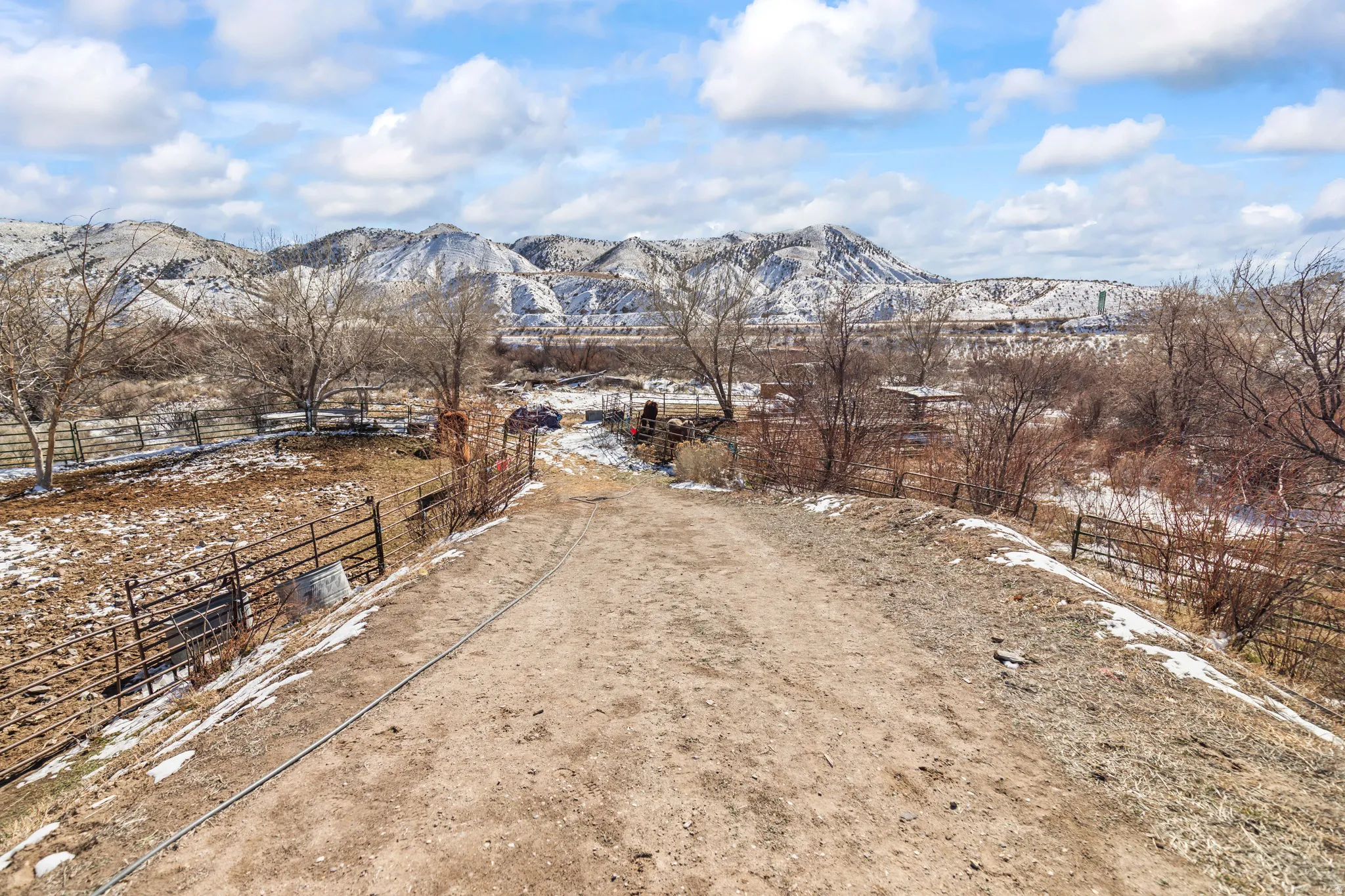 View of mountain background featuring rural landscape