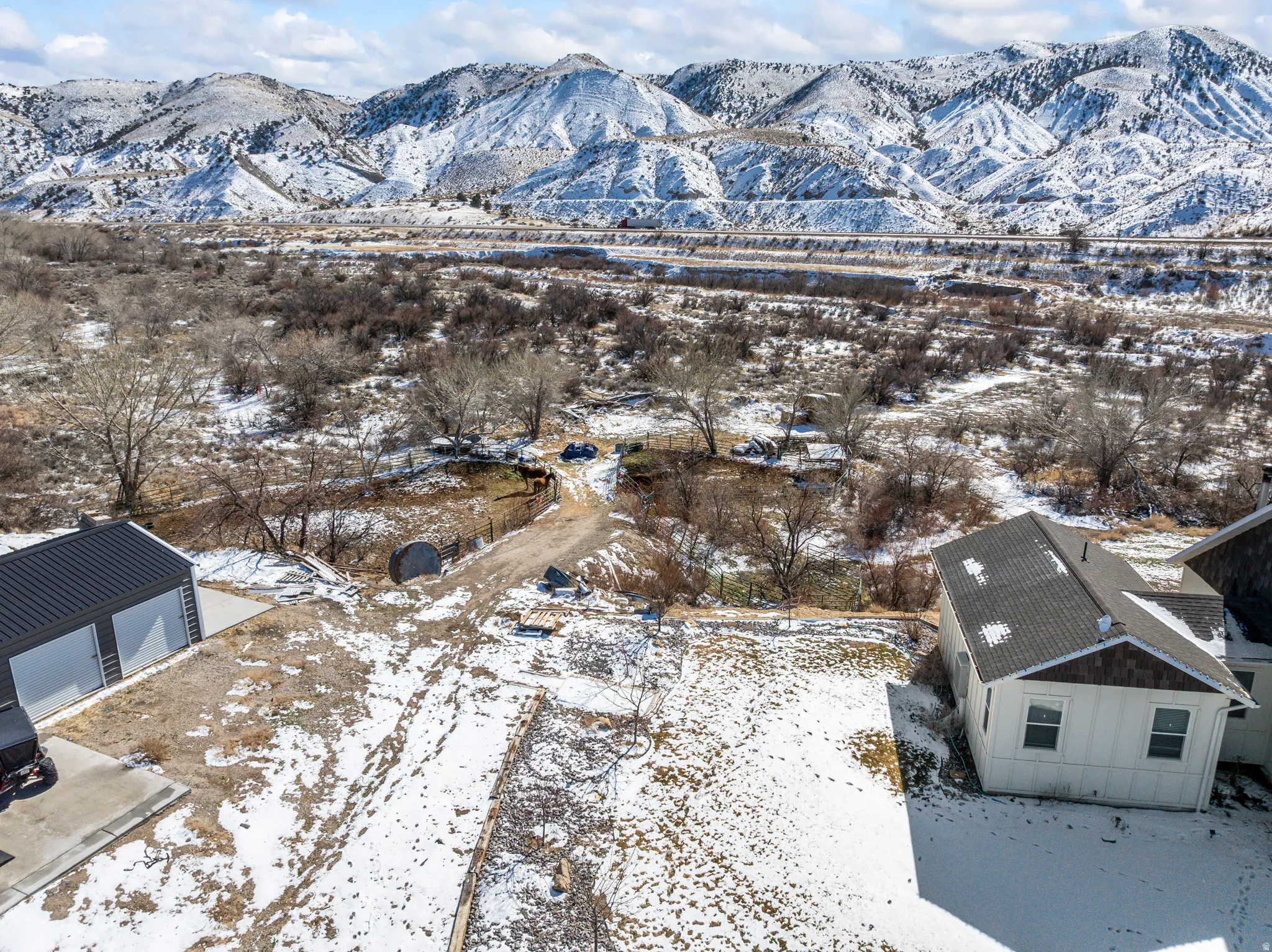 Snowy aerial view featuring a mountain view