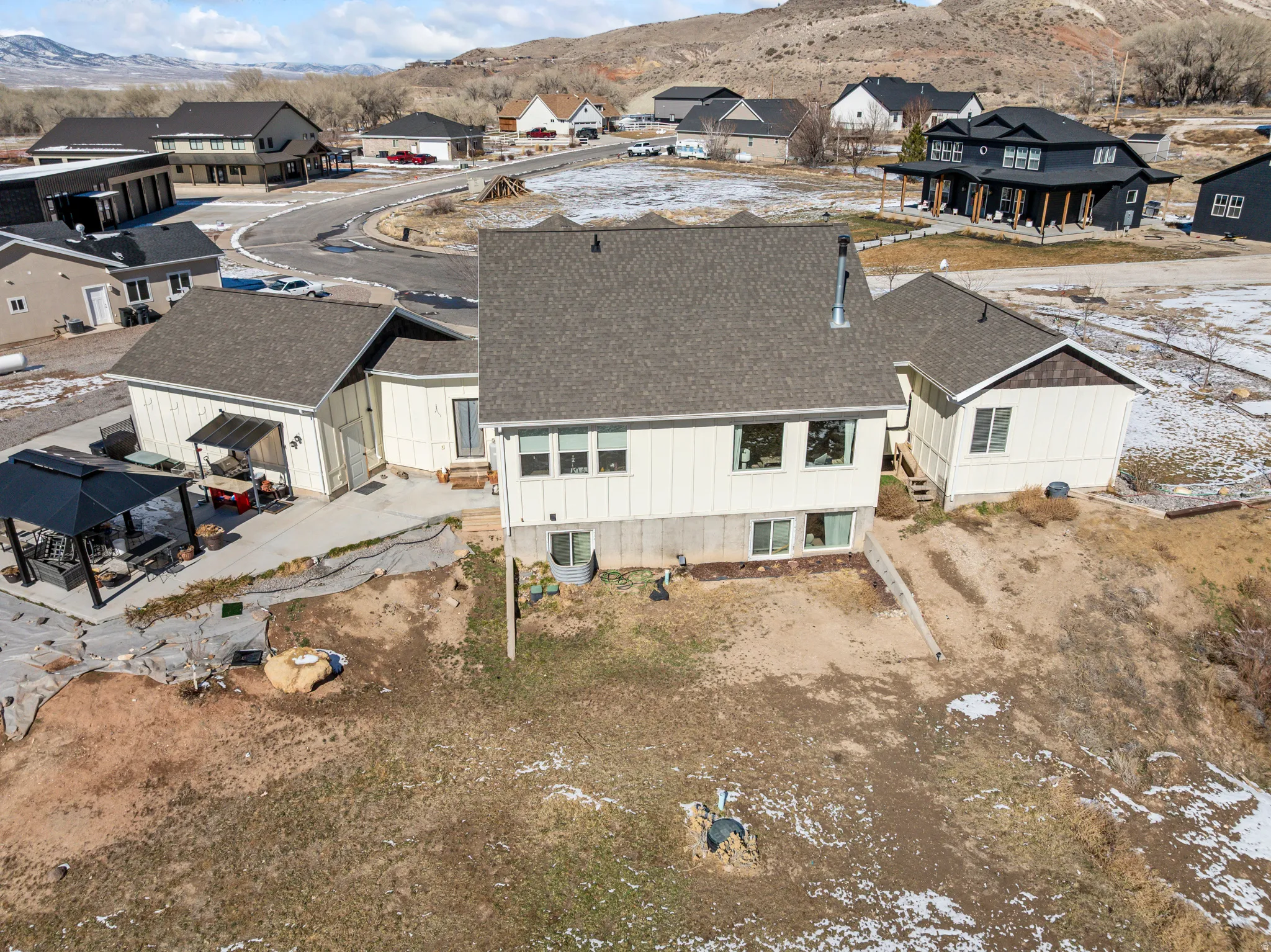 Aerial view of residential area with a mountain backdrop