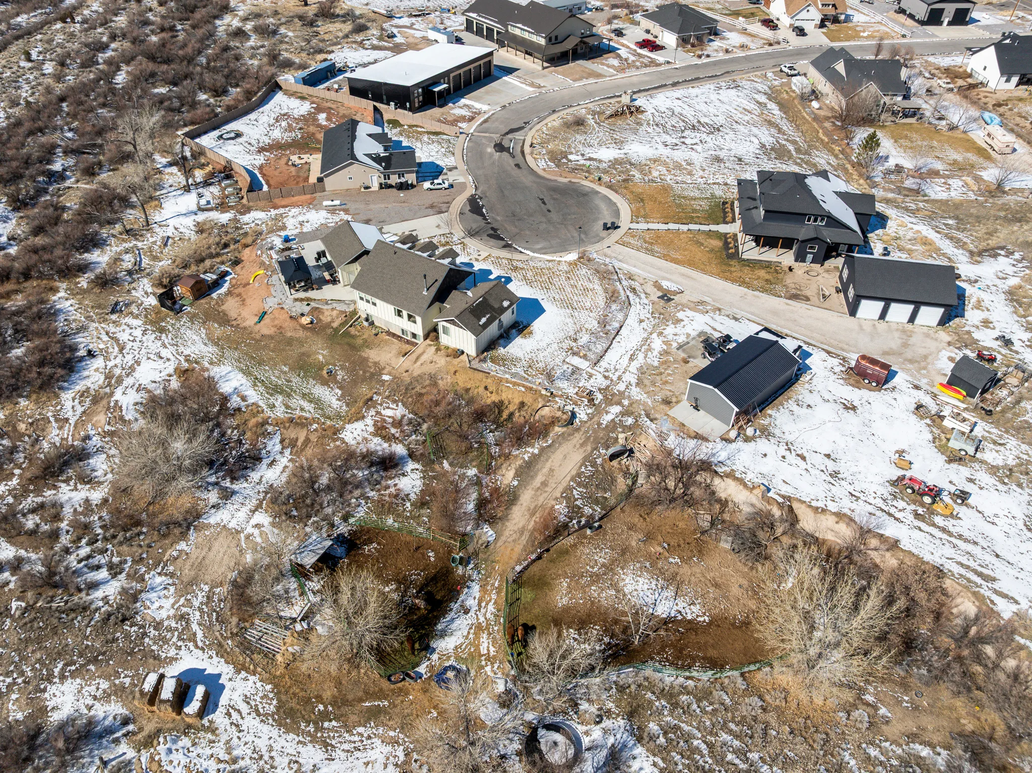 Snowy aerial view featuring a residential view