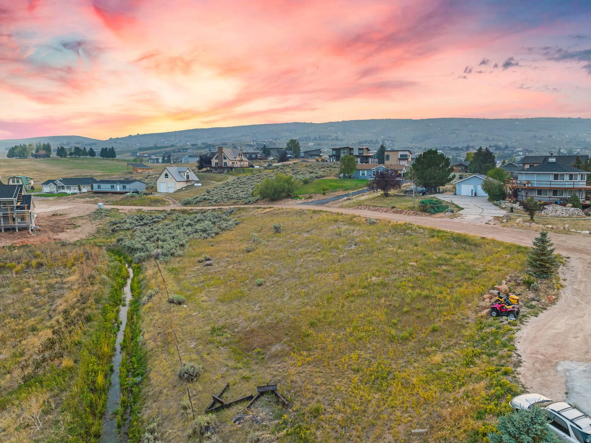 Aerial view of residential area featuring a mountainous background