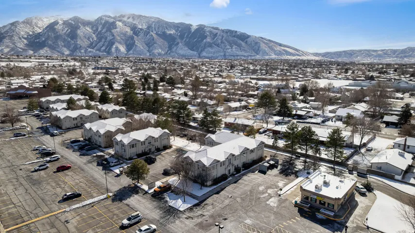 Aerial view of residential area featuring mountains