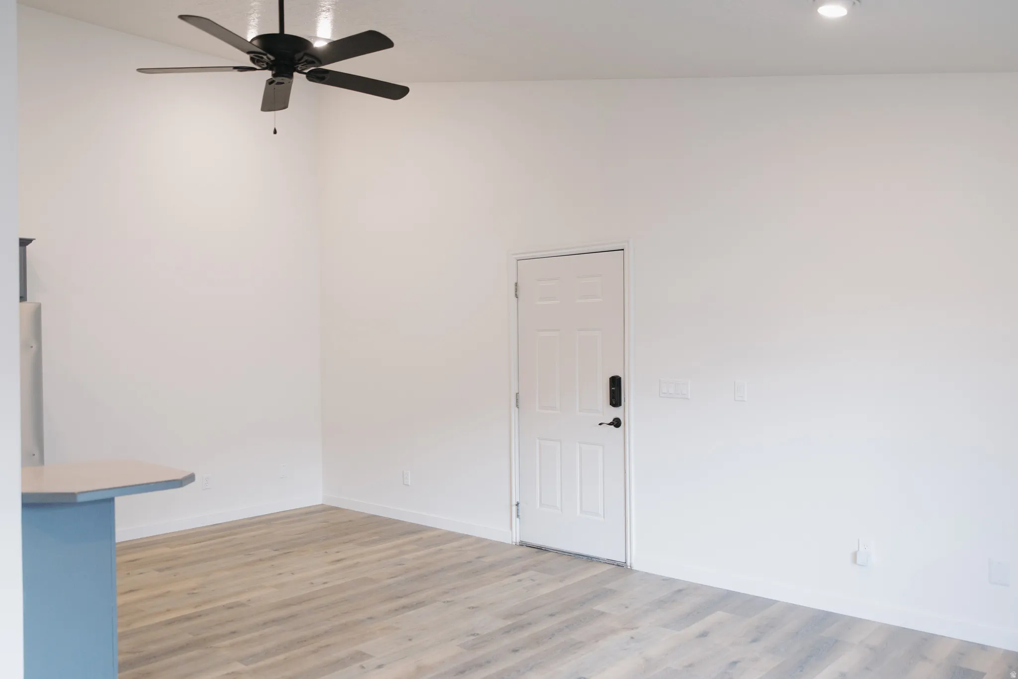 Unfurnished room with light wood-type flooring, a ceiling fan, and recessed lighting