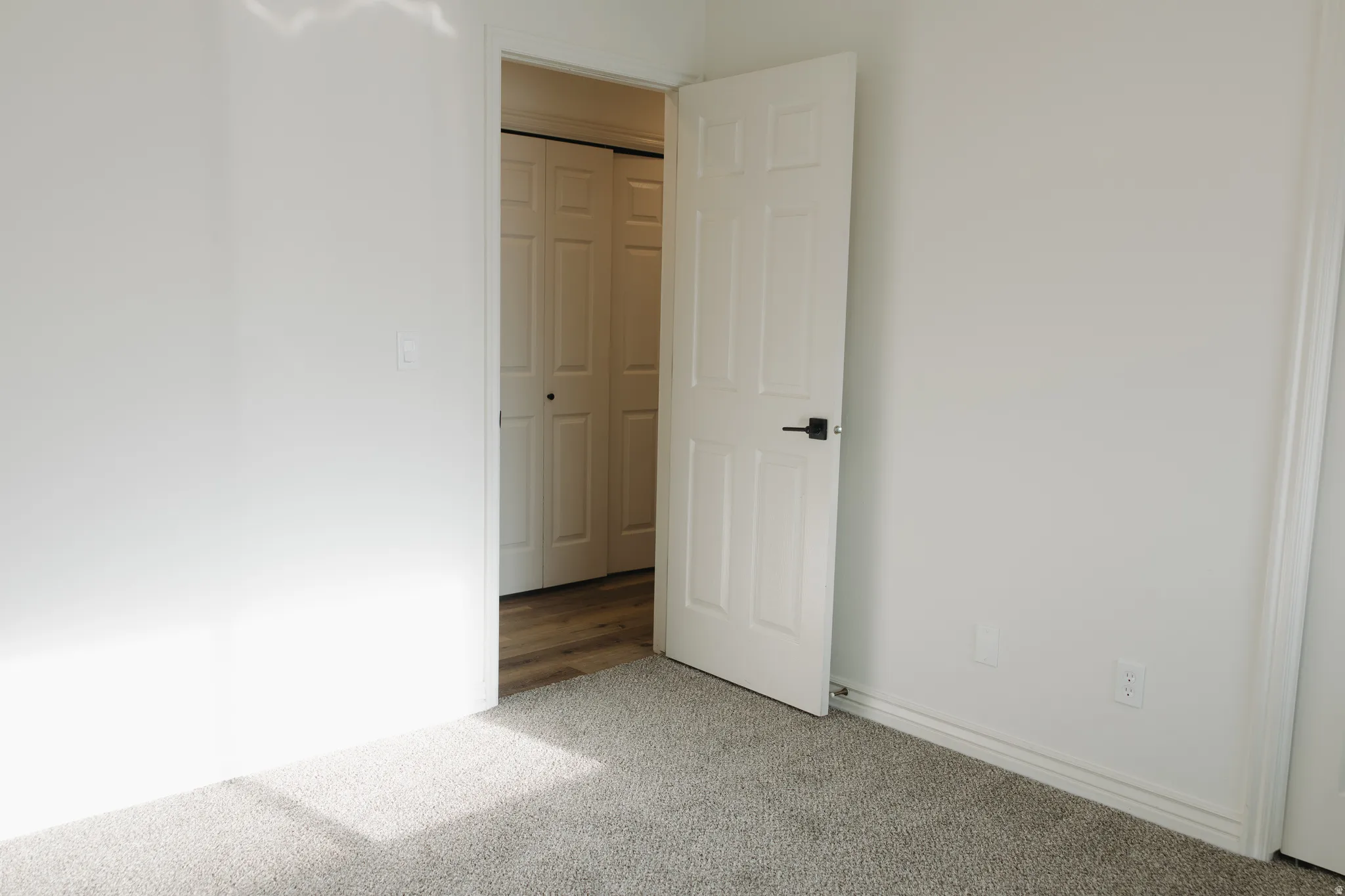 Unfurnished bedroom featuring carpet floors