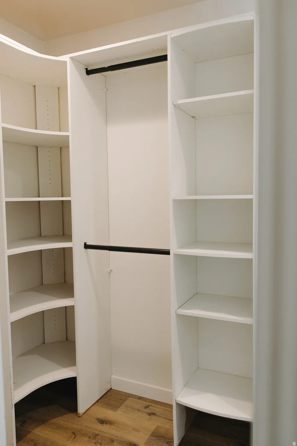 Walk in closet featuring light wood finished floors