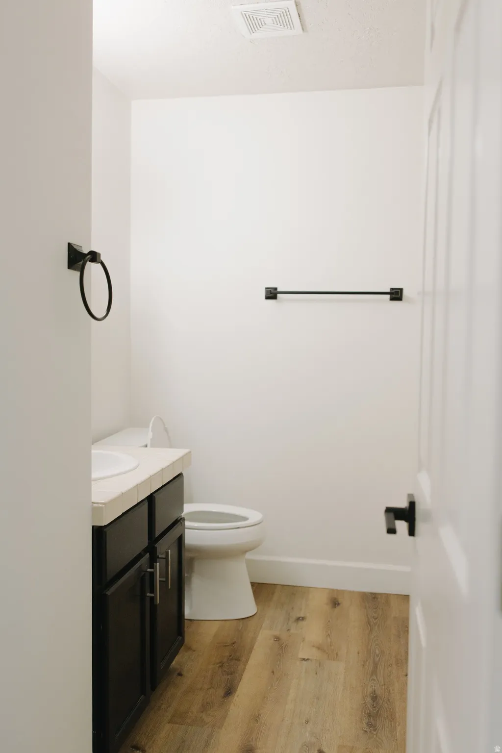 Bathroom featuring vanity and light wood-style flooring