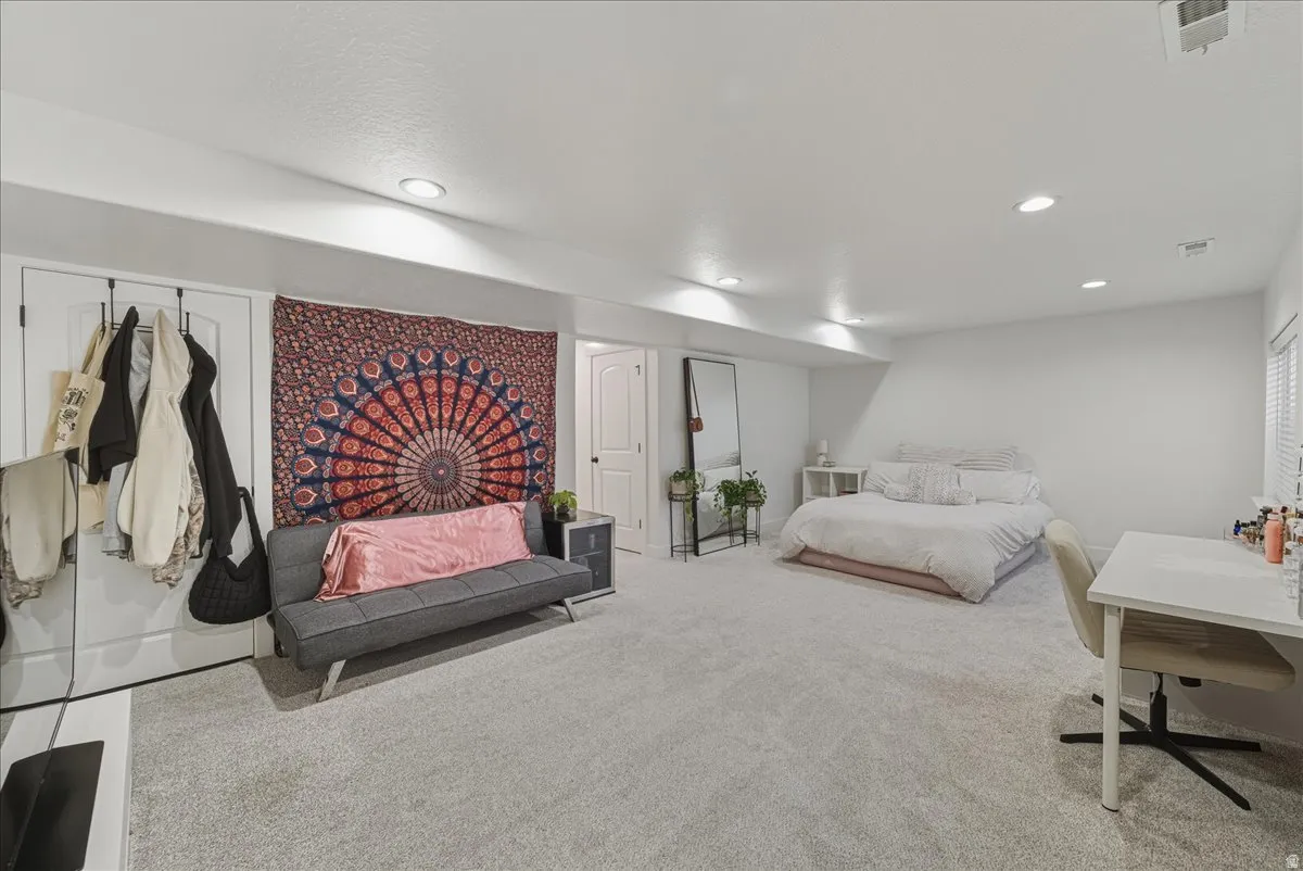 Bedroom with carpet floors and recessed lighting