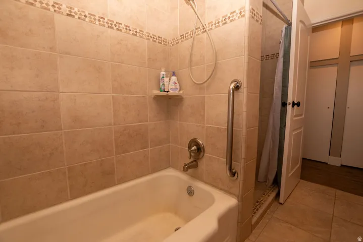 Bathroom with tile patterned flooring