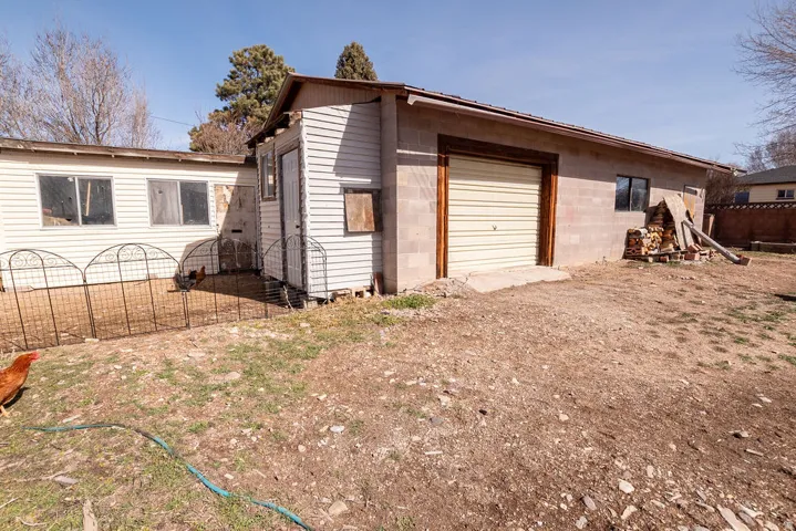 View of side of home with concrete block siding and a garage