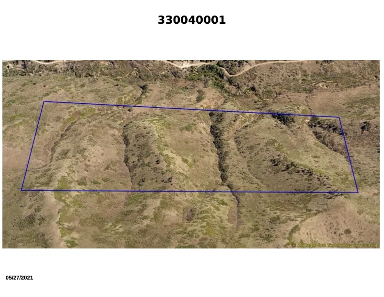 33:004:0001 - Aerial view of property's location showing property parcel outlined. Plat 1