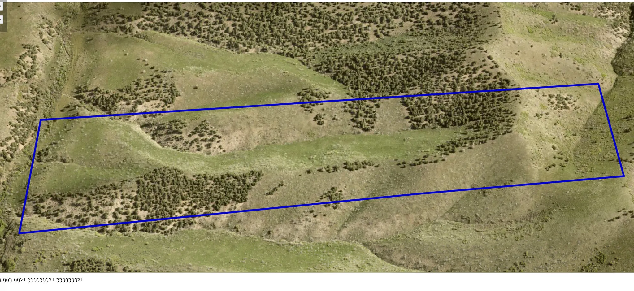 33:003:0021 - Aerial view of property's location showing property parcel outlined. Plat 3