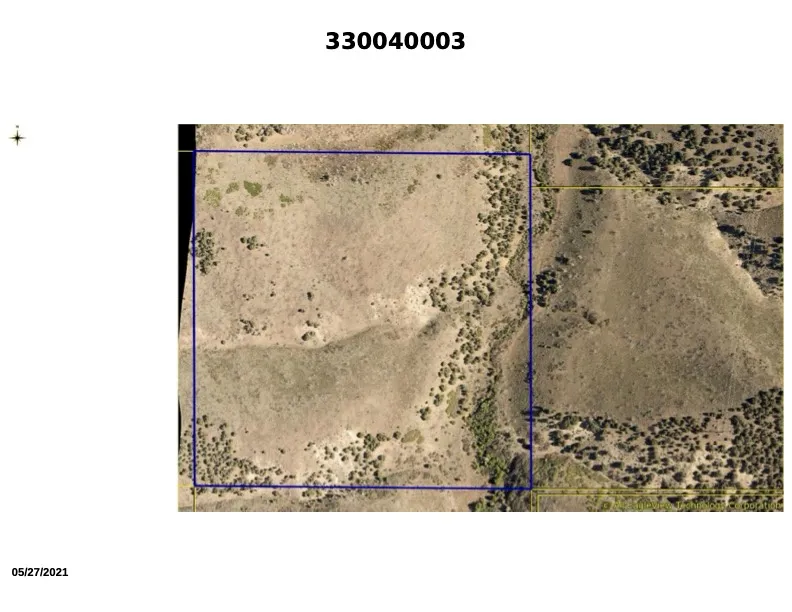 33:004:0003 - Aerial view of property location showing property parcel outlined. Plat 2